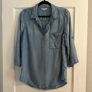 Skies are blue denim top.